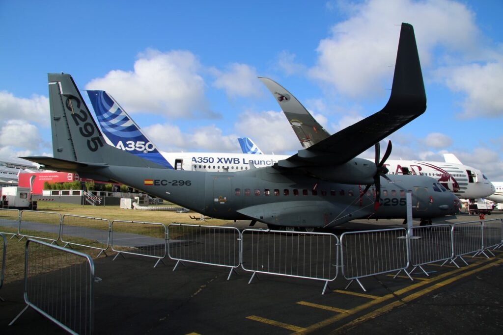 Airbus C295 transport on static display at Farnborough Airshow with an Airbus A350 XWB parked behind it
